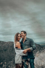 Fototapeta premium couple in love - husband and wife enjoying sunset 