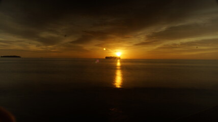 Fototapeta na wymiar SUNSET ON GONDRIAH BEACH, PARIAMAN