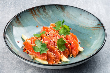 Salmon tiradito with coriander. Asian food.