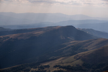 Fototapeta premium Impressive view from a Midzor mountain peak summit, the highest peak of Old mountain,2169 meters above sea level, and a view to surrounding peaks and highlands at summer Old Mountain in Serbia, Europe