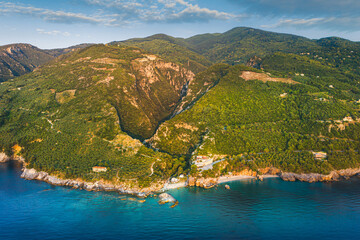 Beautiful Milopotamos beach at Pelion Greece, with arch on sunrise time