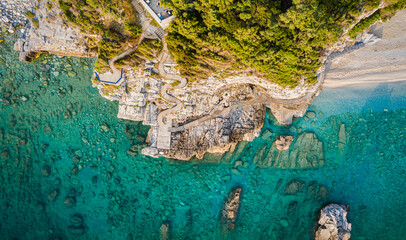 Aerial drone summer background, shot of beautiful beach with rocks and sand on Greece. Best beaches of Mediterranean. © Mariana Ianovska