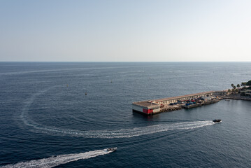 Concrete platform on Mediterranean Sea. Fast motorboats. Monaco. 