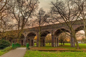 Arnos park in Arnos Grove.  A 44 acre grassy woodland crossed by a brook and a train viaduct in North London.