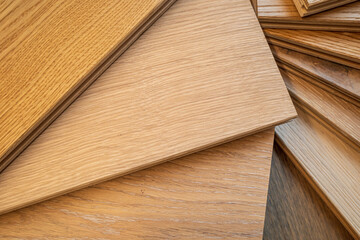 Obraz na płótnie Canvas Top view, selective focus of light Engineered hardwood or laminate flooring samples.