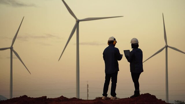 Footage 4K: engineers and technician are talking about wind turbine