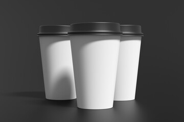 Three white take away coffee paper cups mock up with black lids on black background.