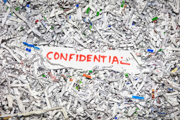 Concept of shredding confidential information to protect identity theft.
