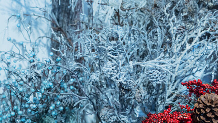 Christmas Background. Composition snow-covered branches, cones and red berries. Happy new year concept.
