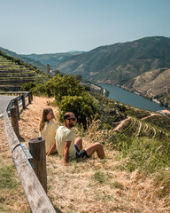 Young couple enjoying the view on vineyards of Douro valley