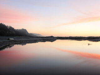 Sundown over Pacific Ocean bay at Gold Bluffs Beach, Prairie Creek Redwoods State Park, northern...