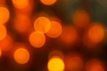 Christmas background red holiday abstract light bokeh and glitter abstract red orange defocused, Gold and black glitter lights with black dark background.