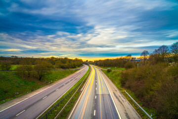 A1M motorway with cars light trails at sunset