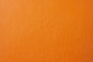 Orange cement wall of home in countryside for background and textures.
