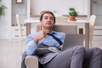 Tired businessman employee working from home