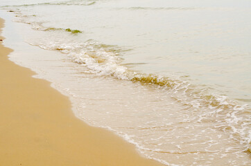 The sea waves hit the beach