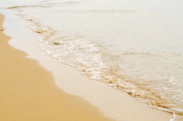 The sea waves hit the beach