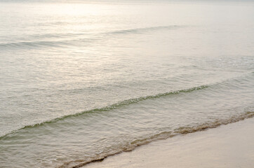The sea waves hit the beach