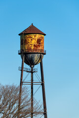 Historic Semiahmoo Water Tower, classic rusted round water tank on a sunny blue day
