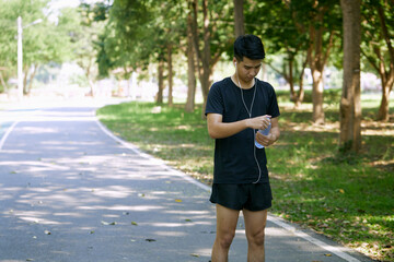 A man standing for a break from exercise