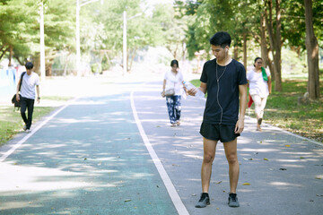 A man standing for a break from exercise