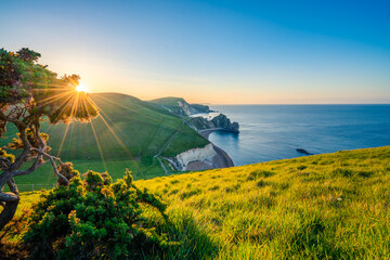 Beautiful sunrise near Jurasic Coast known as Durdle Door in England, UK