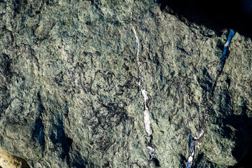 Closeup of blue green rock as a nature background
