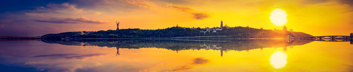 Sunset panorama of Kiev Pechersk Lavra with reflection.  Ukraine