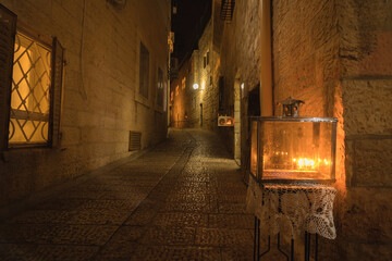 Obraz premium Menorahs are lit, in the Jewish Quarter of the Old City of Jerusalem on Hanukkah