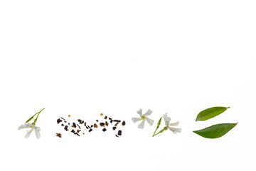 loose green tea with jasmine flowers in bloom isolated on white background