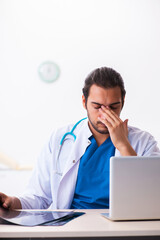 Young male doctor radiologist working in the clinic