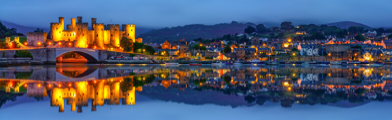 Panorama of Conwy Castle at dusk located in Conwy. North Wales, UK