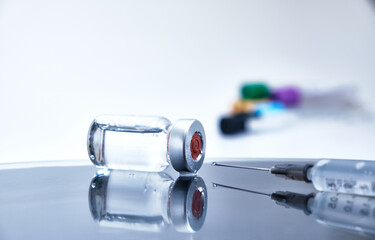 Vaccine and syringe injection. It use for prevention,immunization and treatment from corona virus infection. syringe and vials. Vaccine for coronavirus on white background.