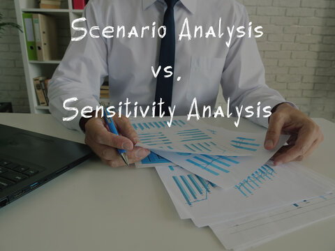  Financial concept about Scenario Analysis vs. Sensitivity Analysis with inscription on the piece of paper.