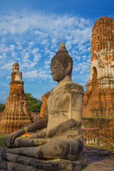 Ancient statue of a sitting Buddha on the ruins of the Buddhist temple Wat Ratchaburana in the...