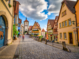 Fototapeta na wymiar Traditional German architecture of Rothenburg ob der Tauber city with timbered houses in morning light. Bavaria, Germany