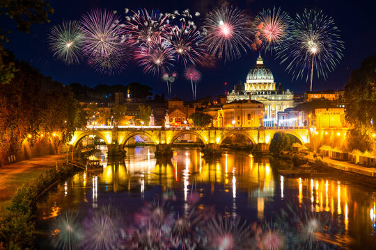 Fireworks display near Sant' Angelo Bridge and St. Peter's cathedral in Vatican City, Rome.Italy