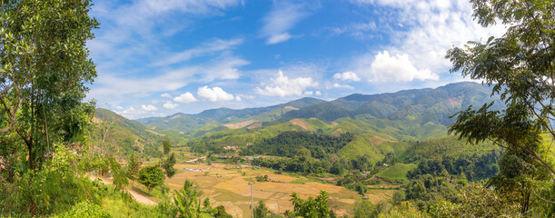 Fototapeta na wymiar Panorama landscape of mountain forest with blue sky and white cloud at Spun, Nan Province, Thailand, Asia.