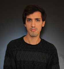 Fototapeta premium Depressed man, angry man looking bad black background
