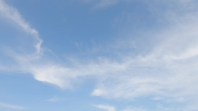 Fluffy puffy white cirrus or cirrostratus white cloud n cumulus cloudscape on beautiful sunny clear blue sky background in tropical summer or spring sunlight n sunray, 4k cinemagraphs b-roll TimeLapse