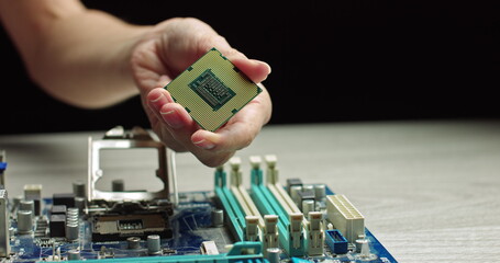 A gloved holds a processor. Close-up Presentation of a New Generation Microchip. Gloves Holding...