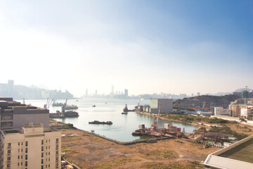 Fototapeta na wymiar Kowloon, Hong Kong - 10.12.2020 : view of port near Kwun Tong Tsai Wan, Victoria Harbour seen from Yau Tong