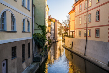 Fototapeta na wymiar Water canal at sunrise. Old Prague. Czech Republic 