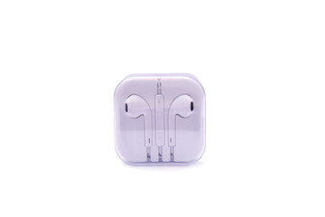 White wired earphones on white background