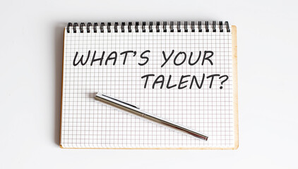 Notebook with pen and Notes about what's your talent , business
