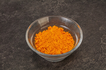 Tumeric powder in the bowl