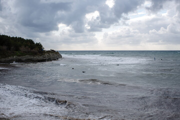 Light storm at sea with dark clouds