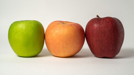 Three types of apple on a white background.