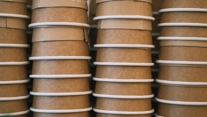 stacked paper cups ready for coffee at the cafe
