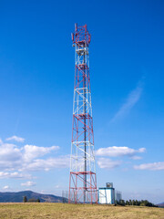 Radio mast at Kota summit. Lubovnianska vrchovina mountains in spring, Slovakia.